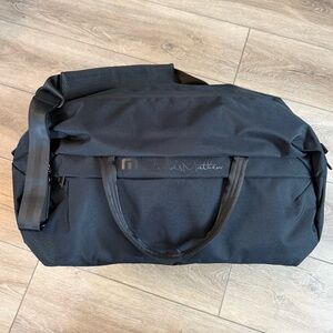 NWT Travis Mathew Lateral Duffel Travel Black Bag w/Logo On One Side Golf